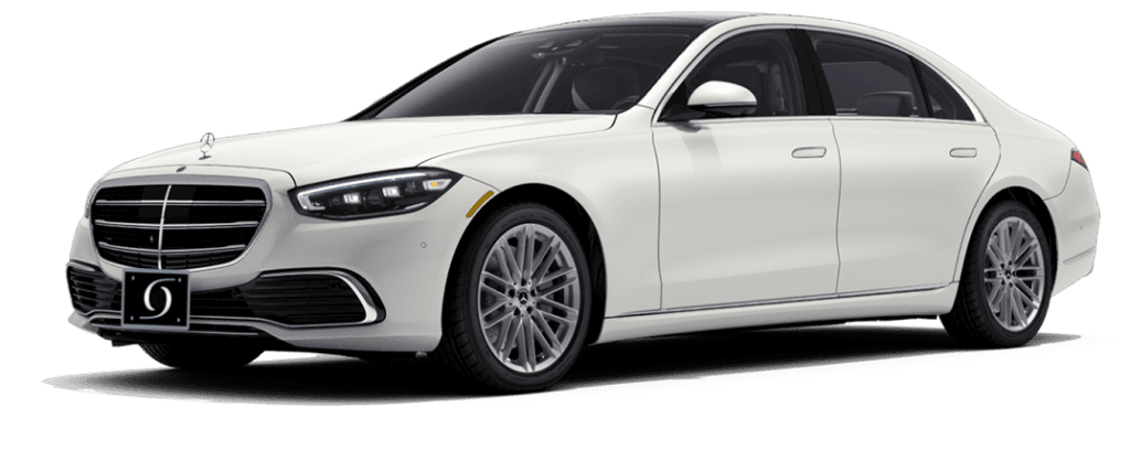 Metallic white Mercedes-Benz S-Class luxury sedan private hire vehicle cut out.
